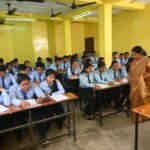 Students preparing for government competitive examinations in a classroom