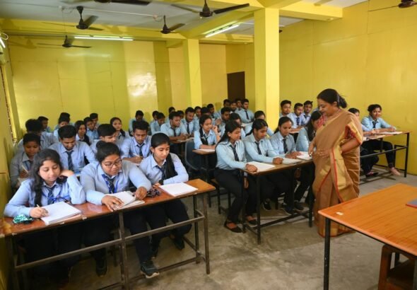 Students preparing for government competitive examinations in a classroom